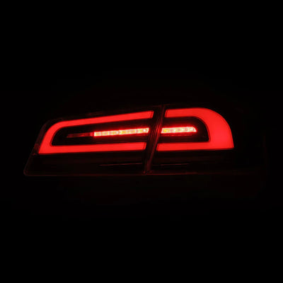 AlphaRex 12-21 Tesla Model S LUXX-Series LED Tail Lights Black Red (With Black Trunk Center Piece Replacement)