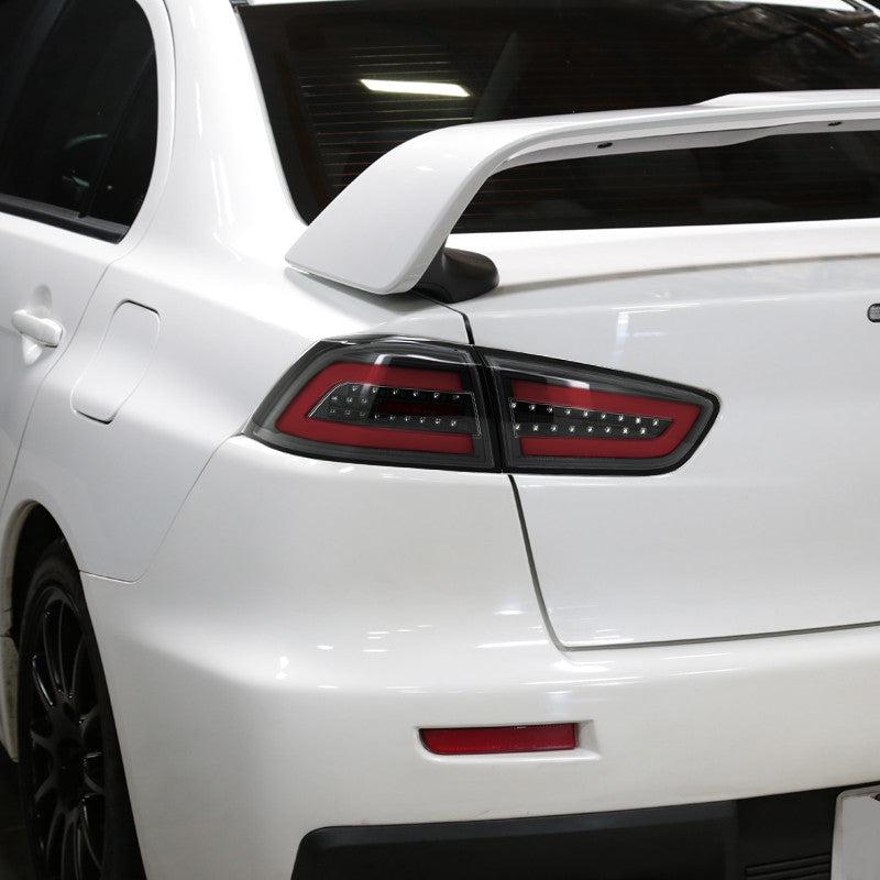 Spec-D 08-17 Lancer EVO X LED Tail Lights Black/Clear Lens Red Bar