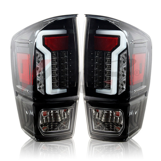 Winjet 2016-23 Toyota Tacoma LED Tail light - Glossy Black / Clear